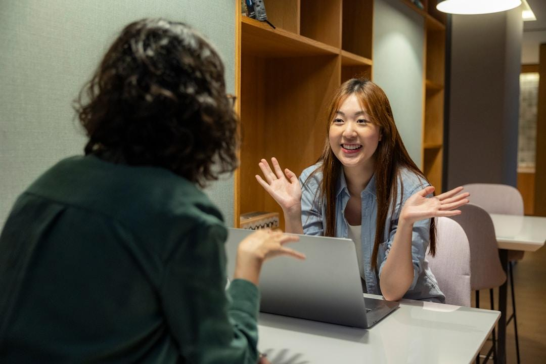 Two professionals discussing marketing multi-channel strategies to help brands connect with their target audience across various touchpoints